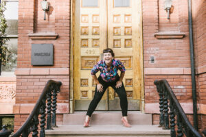 a femme on a brownstone stoop thinking of course they did